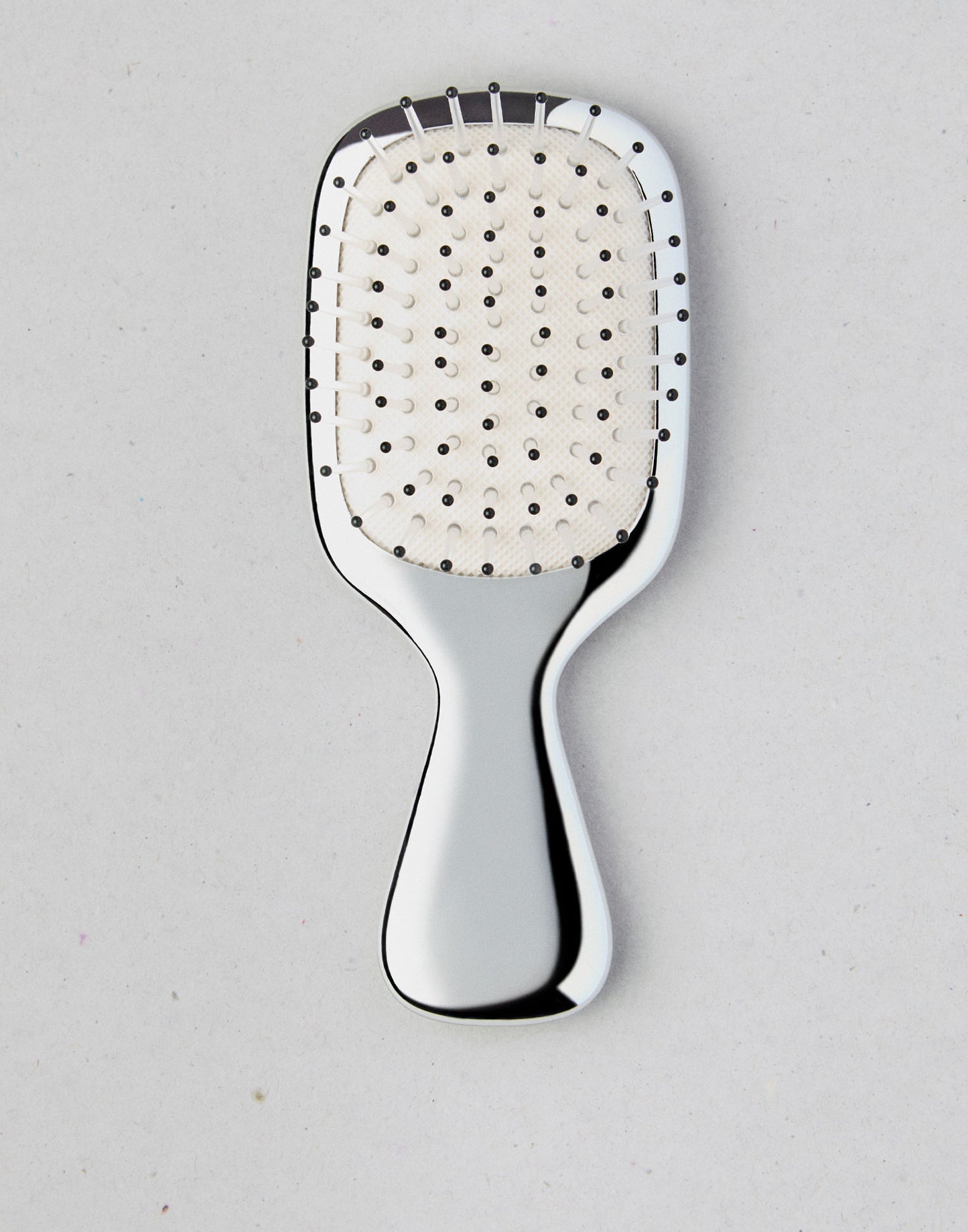 Cepillo pelo plateado