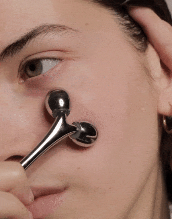 Massage facial en métal à rouleaux