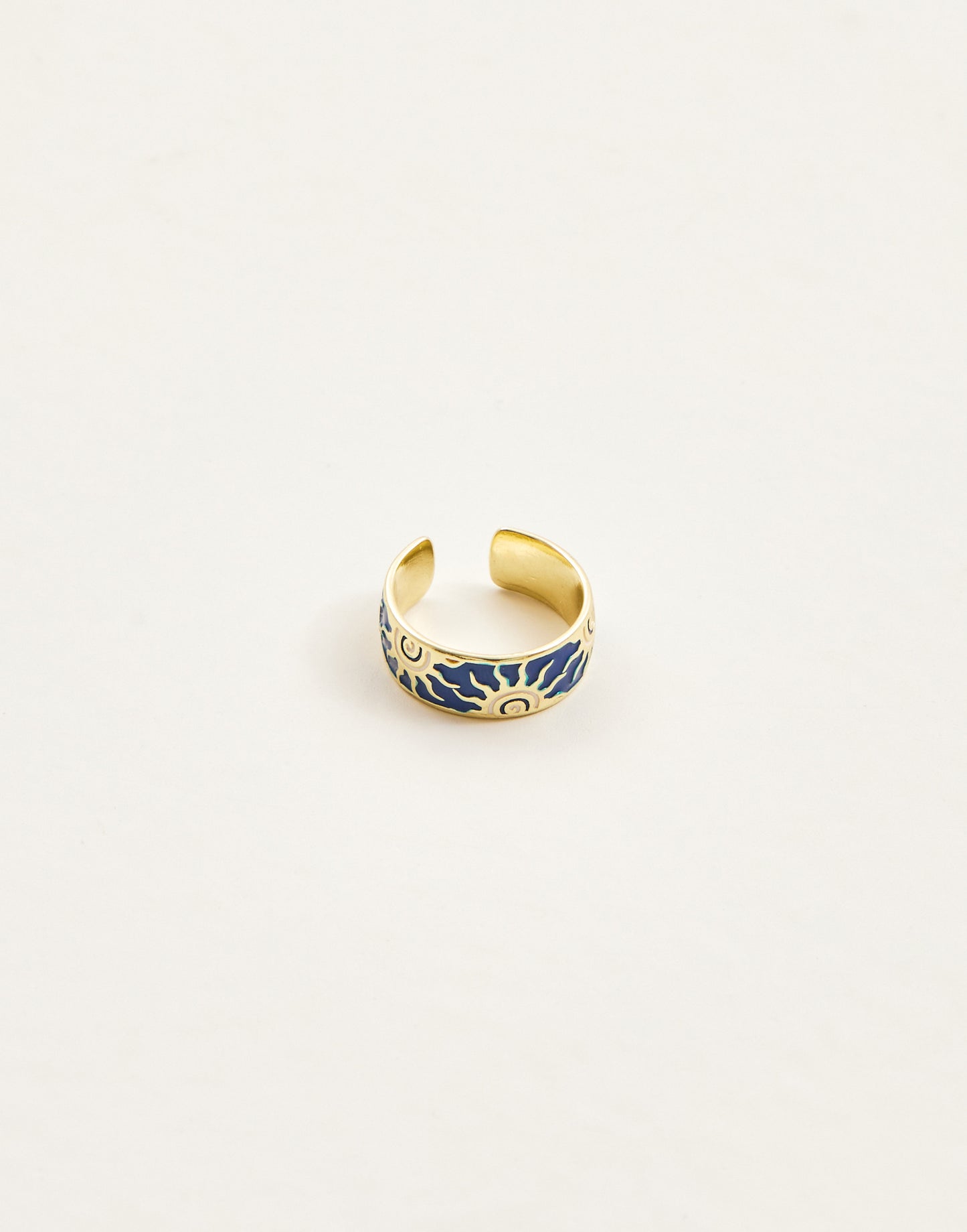 Wide ring with sun motifs