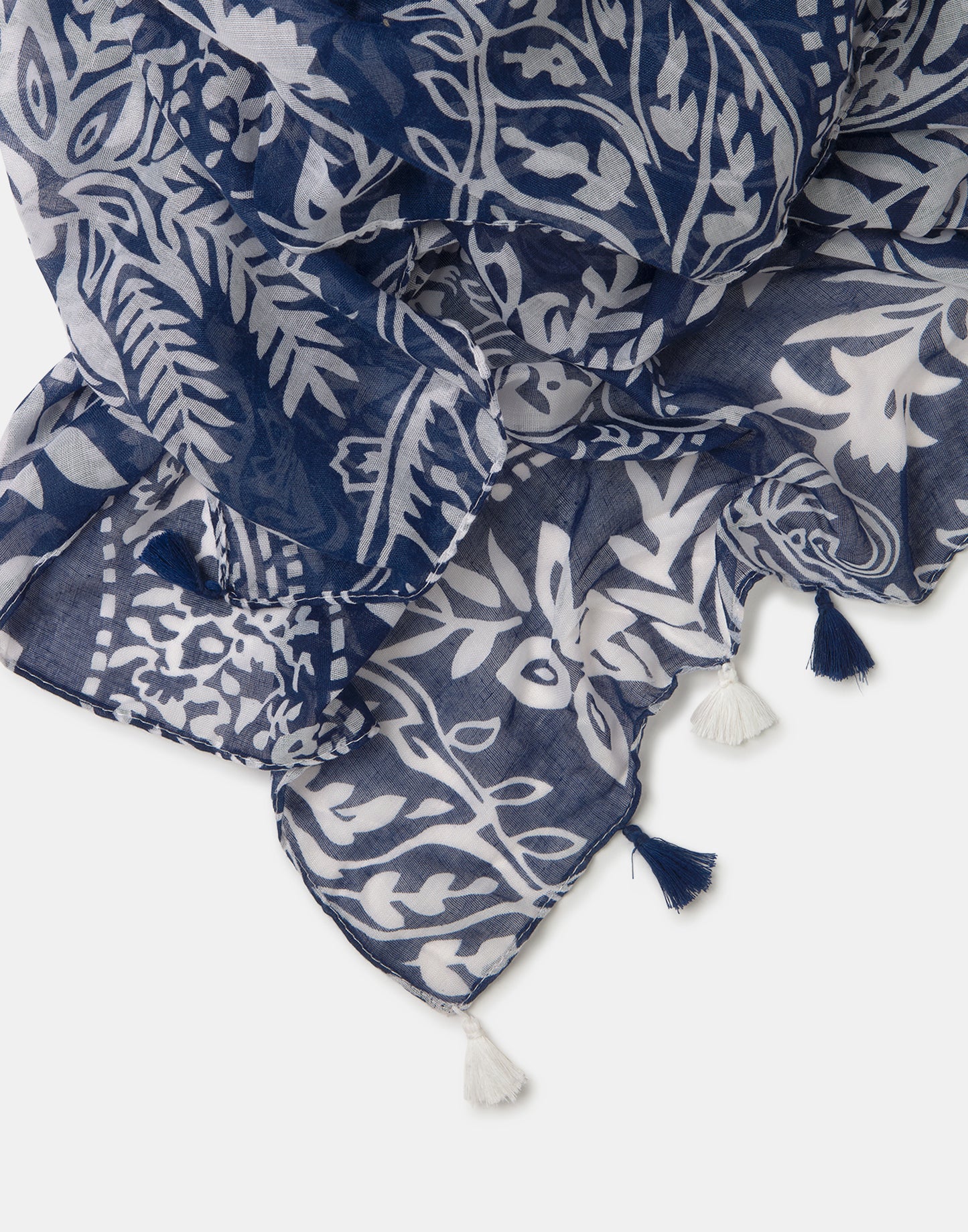 Printed scarf with pompoms