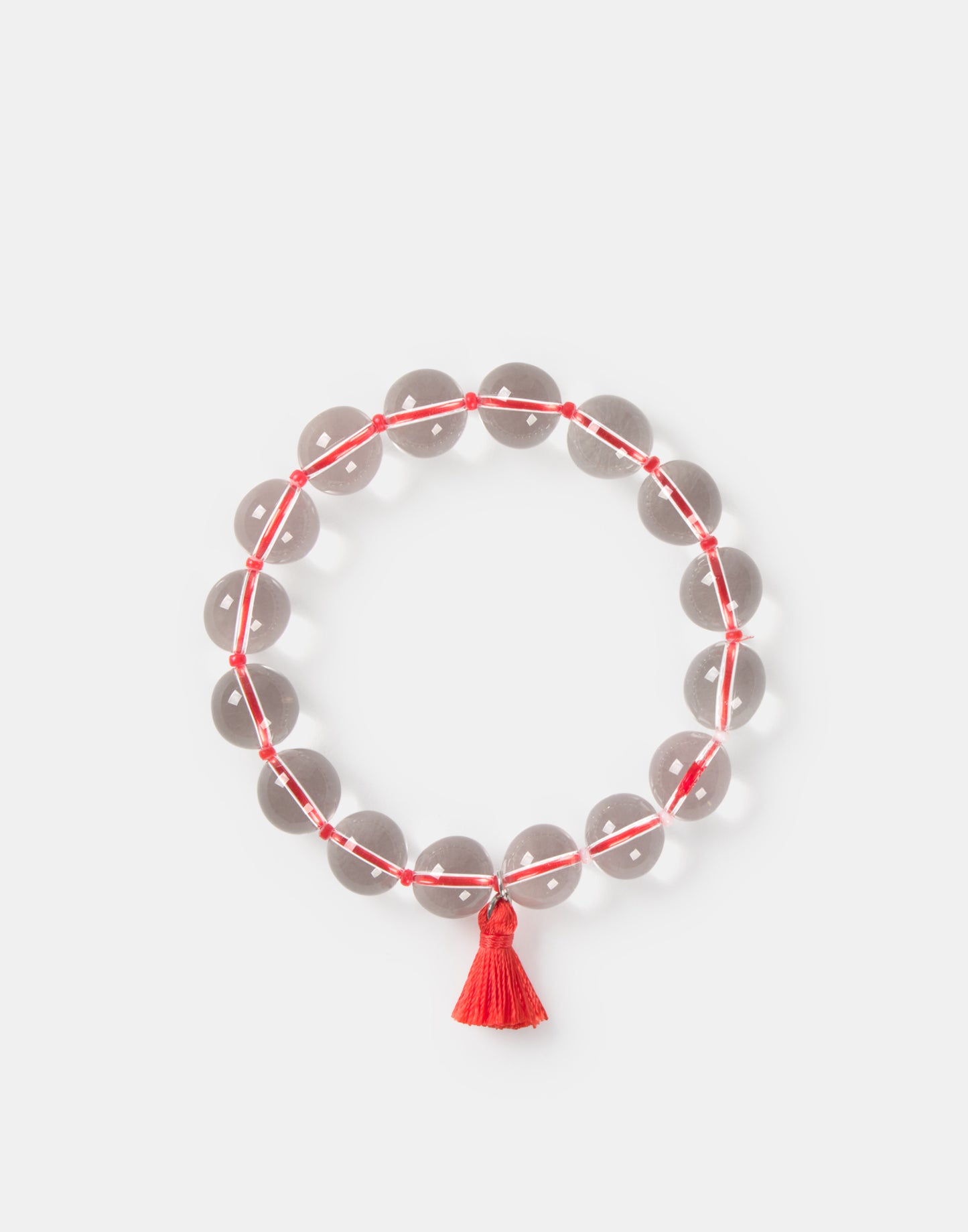 Pulsera transparente pompón