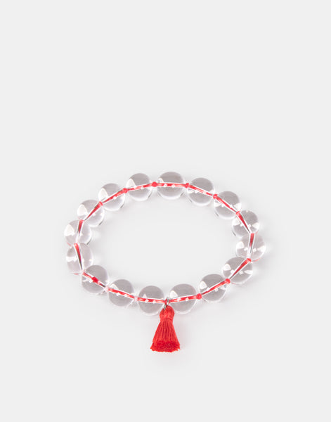 Pulsera transparente pompón